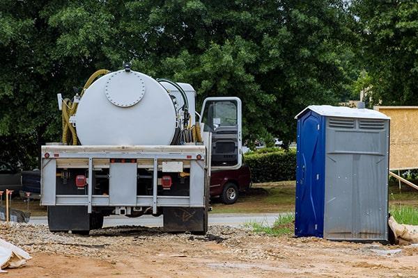New Britain Portable Sanitation Group team servicing a portable restroom unit